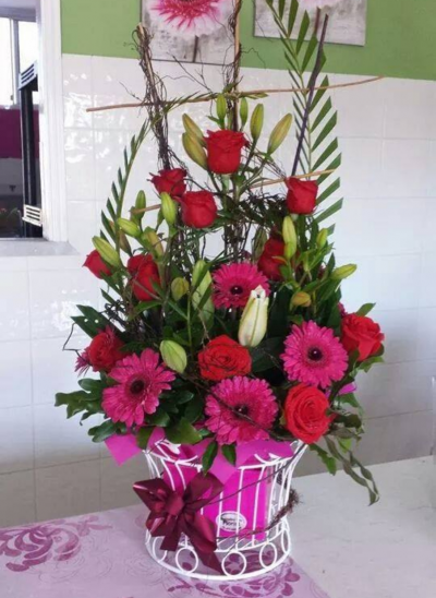 Pretty Basket - A  basket arrangement of fresh cut flowers in pale pink and whites.
