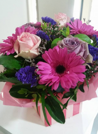 Warm Wishes - Send this vibrant hand-tied featuring a mix of favourite flowers delivered in a delightful gift bag or box is the perfect way to send your thoughts.
