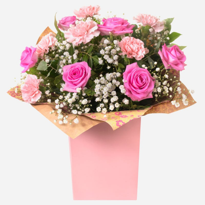 Roses & Ruffles
 - Pink Roses and Carnations make this gift timeless and classic
