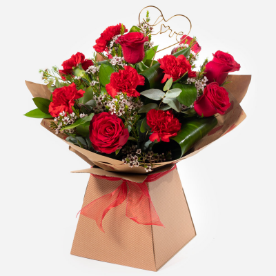 Smooch - Roses and carnations make the perfect couple when combined in this timeless and romantic gift that is sure to impress.
