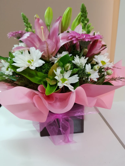 Beautiful Blooms - A Designer's Choice Arrangement to suit your occasion. Choose Pretty and Pastel or Bright and Beautiful, presented in a complimenting colour box with matching ribbon.
