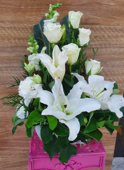 Evelyn - A fabulous collection of white and cream flowers make this the perfect gift. This bouquet will be hand delivered by the local florist.