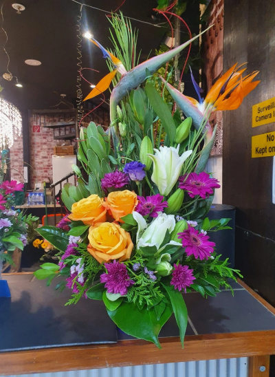 Jelly Bean - This amazing profusion of colour is bound to brighten the dullest of days. A vibrant and joyful floral gift with character in abundance. 

*Fine Print: Every bouquet is hand made and delivered by the local florist. Pictures shown are recent examples of an actual arrangement that were designed by talented florists and later sent out to a customer just like you! Please note that each individual florist cannot guarantee what the flower varieties or colours will be; flowers, containers and packaging may be substituted by the independent local florist delivering your order.