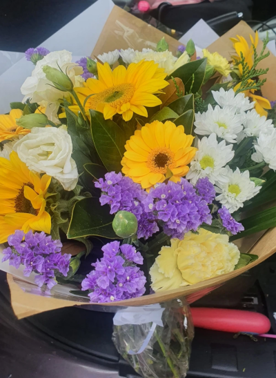 Sunshine - A pleasing colour selection suitable for any occasion. The florist will select yellows, whites and greens to deliver a lovely hand tie bouquet. *Fine Print: Every bouquet is hand made and delivered by the local florist. Pictures shown are recent examples of an actual arrangement that were designed by talented florists and later sent out to a customer just like you! Please note that each individual florist cannot guarantee what the flower varieties or colours will be, they do guarantee that your specific arrangement will be fresh, beautiful and that your recipient will love it!